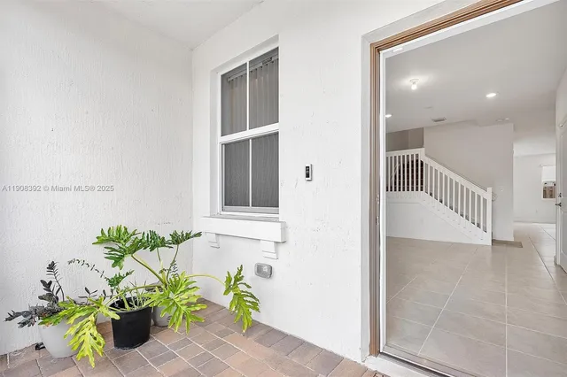 a view of entryway with wooden floor