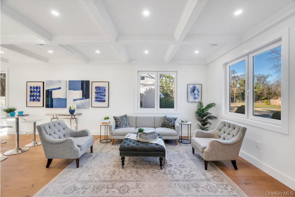126 Rim Lane Hicksville, NY 11801 - Photo 7 of 28 Living room featuring beamed ceiling, coffered ceiling, wood finished floors, and recessed lighting