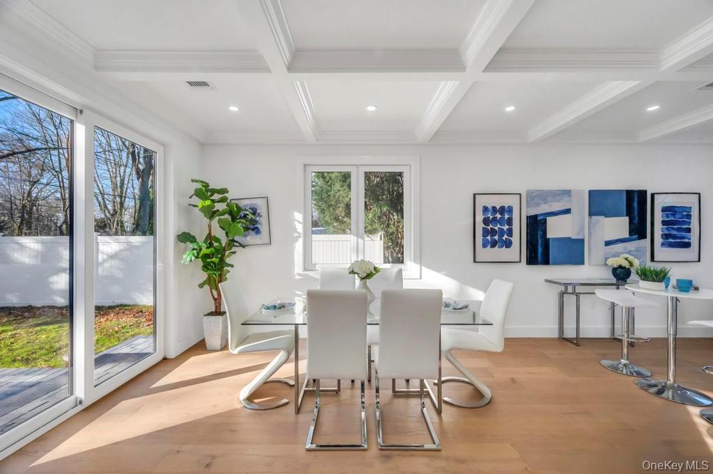 126 Rim Lane Hicksville, NY 11801 - Photo 10 of 28 Dining room with coffered ceiling, beam ceiling, light wood-style flooring, recessed lighting, and ornamental molding