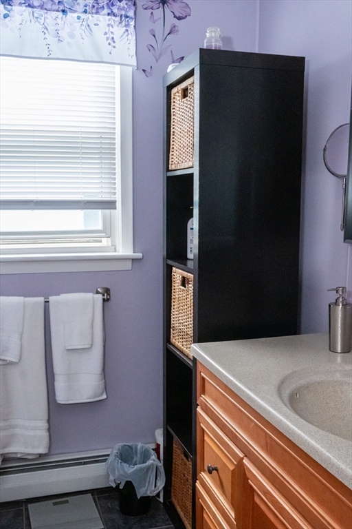 15 Oliver Street Fall River, MA 02724 - Photo 11 of 18 a kitchen with a refrigerator and a stove top oven