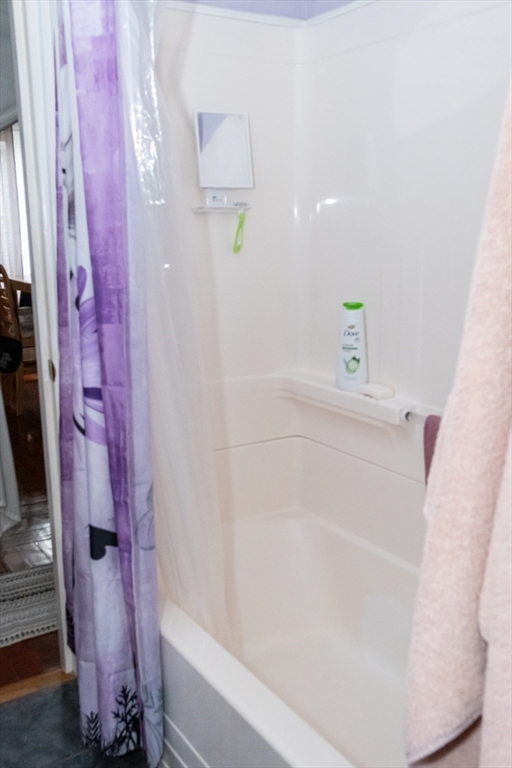 15 Oliver Street Fall River, MA 02724 - Photo 12 of 18 a bathroom with a bathtub