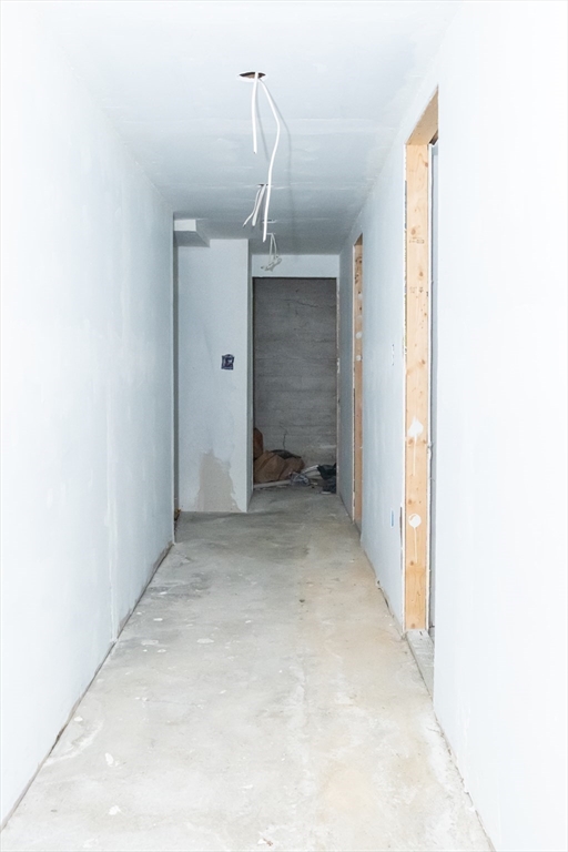 15 Oliver Street Fall River, MA 02724 - Photo 16 of 18 a view of a hallway with wooden floor and entryway