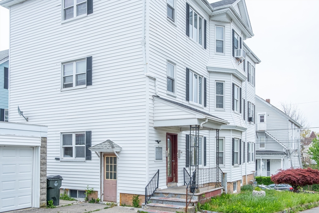 15 Oliver Street Fall River, MA 02724 - Photo 2 of 18 a view of a building with a yard