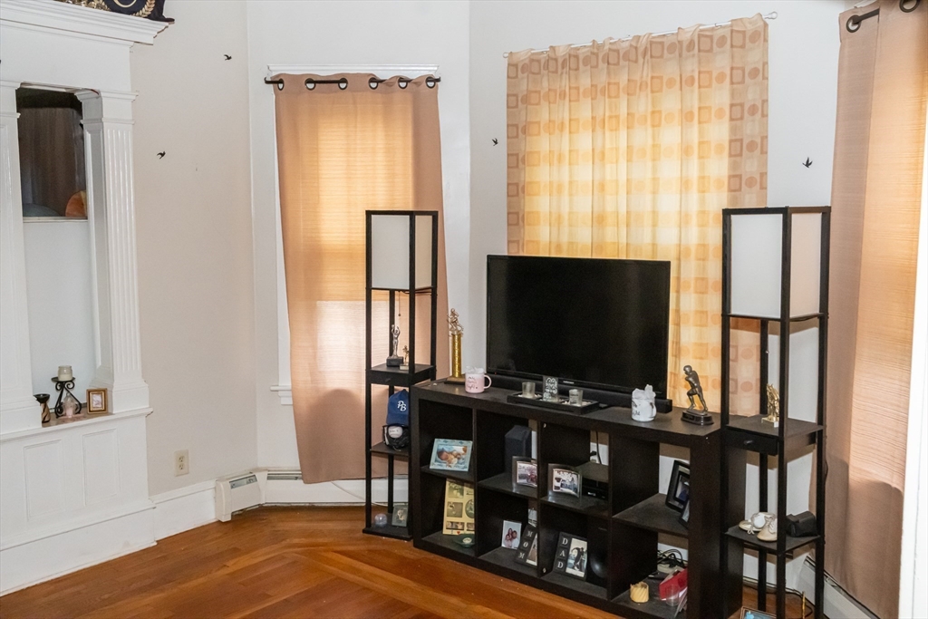 15 Oliver Street Fall River, MA 02724 - Photo 7 of 18 a room with wooden floor and windows