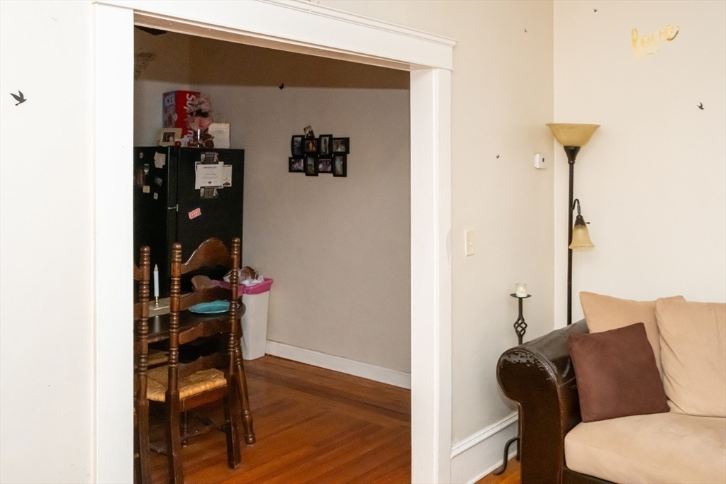 15 Oliver Street Fall River, MA 02724 - Photo 8 of 18 a living room with furniture and wooden floor