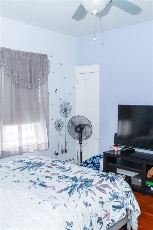 15 Oliver Street Fall River, MA 02724 - Photo 9 of 18 a bedroom with a bed and a flat screen tv