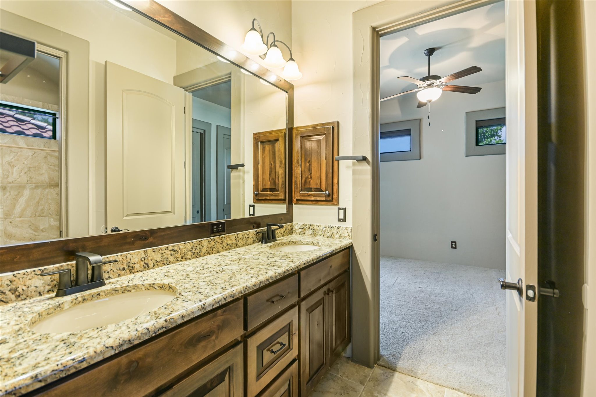 228 Puzzle Pass Spring Branch, TX 78070 - Photo 23 of 35 Shared bath has a split-layout with separate vanity area & private shower/toilet room.