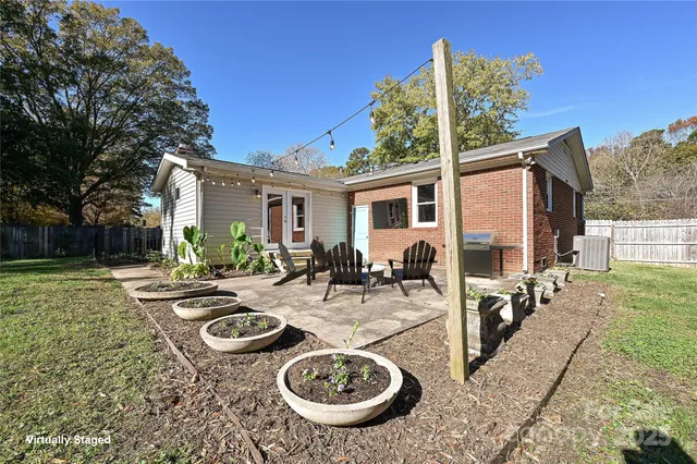 a view of a patio with couches chairs and a fire pit