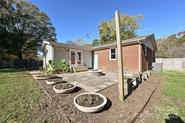 a view of a patio with furniture and yard