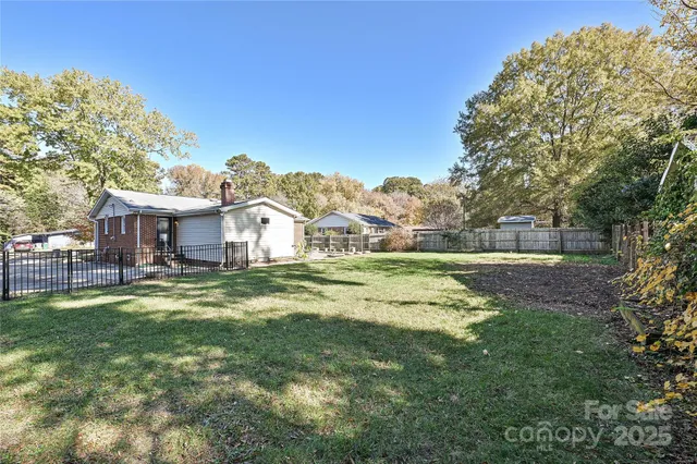 a view of a house with a big yard