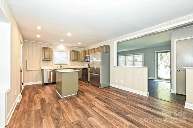 a view of kitchen with wooden floor