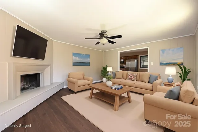 a living room with furniture fireplace and a flat screen tv