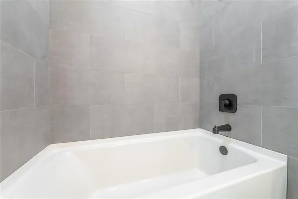 a bathroom with a sink a toilet and bathtub