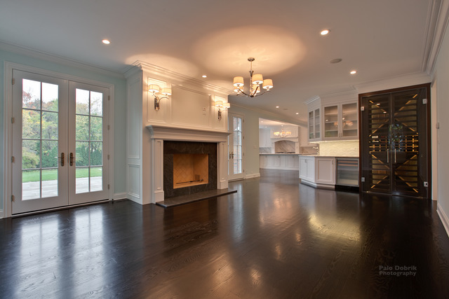830 Lake Road Lake Forest, IL 60045 - Photo 3 of 10 an empty room with wooden floor fireplace and windows