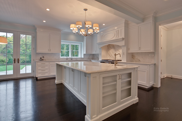 830 Lake Road Lake Forest, IL 60045 - Photo 4 of 10 a kitchen with stainless steel appliances a stove a sink dishwasher a microwave oven and a dining table with wooden floor