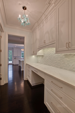 830 Lake Road Lake Forest, IL 60045 - Photo 5 of 10 a hallway with a sink and chandelier