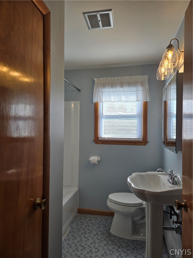 417 Locust Drive Utica, NY 13502 - Photo 14 of 25 The updated full bath features stylish, durable ce