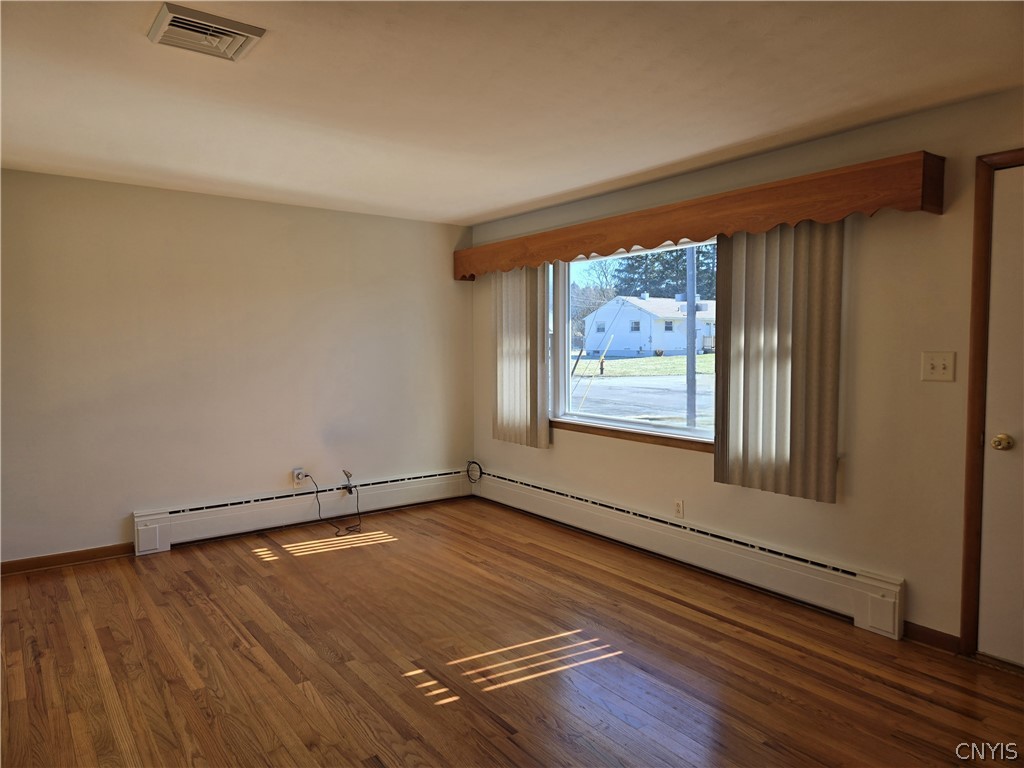 417 Locust Drive Utica, NY 13502 - Photo 3 of 25 Sun shines through the new large living room.
