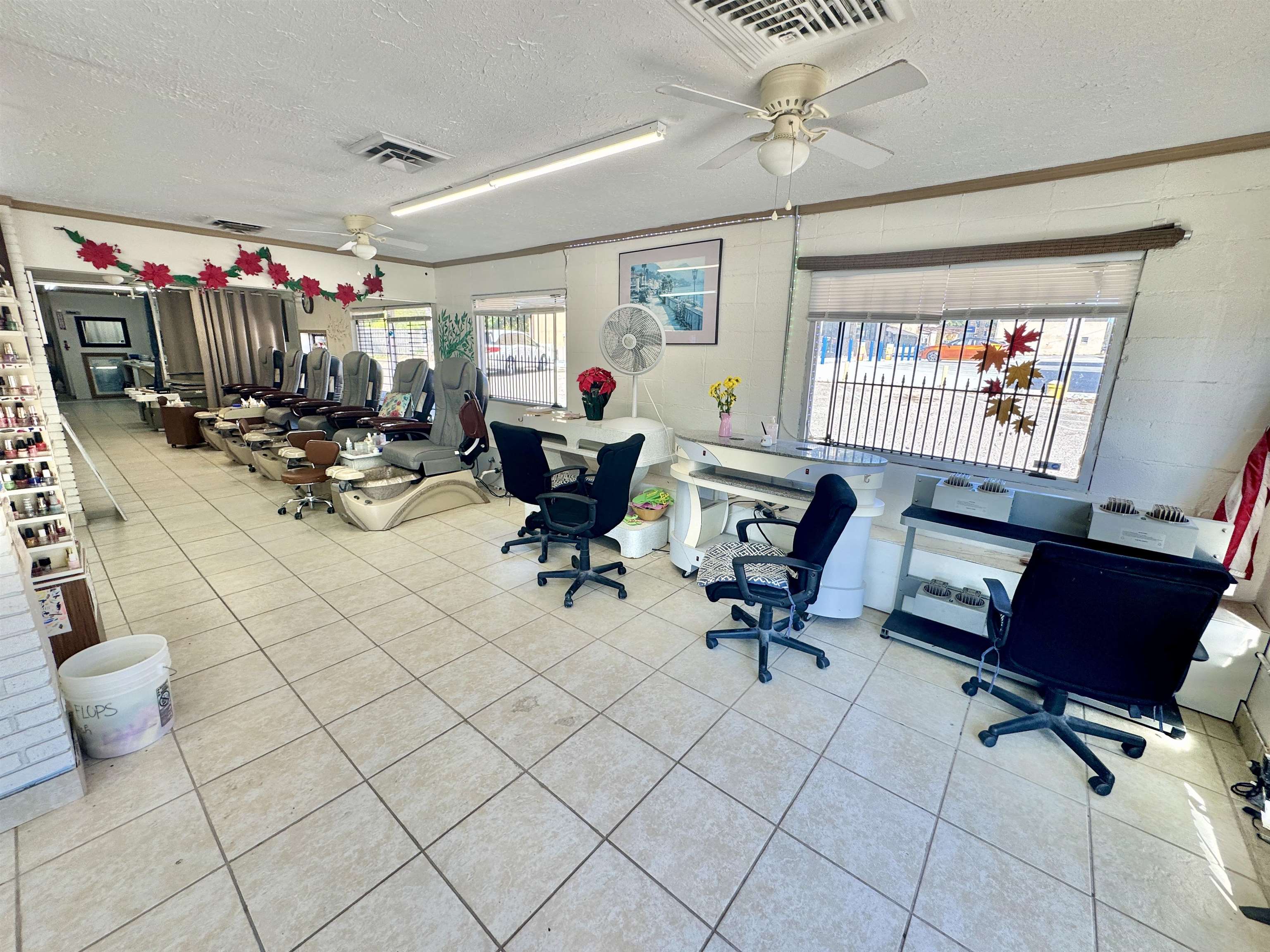 289 Washington Street Ripley, TN 38063 - Photo 8 of 10 a living room with furniture a flat screen tv and a floor to ceiling window