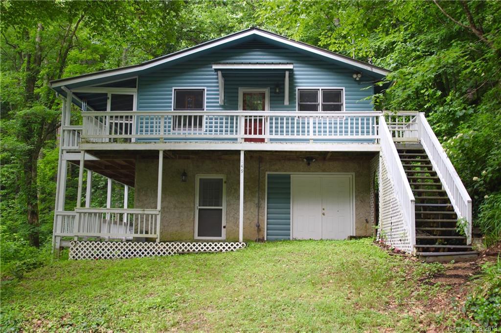 149 Irwin Way Clyde, NC 28721 - Photo 1 of 29 a front view of a house with a garden