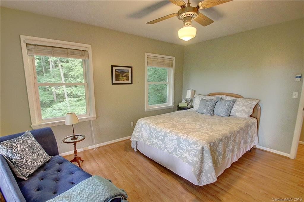 149 Irwin Way Clyde, NC 28721 - Photo 12 of 29 a bedroom with a bed and a window