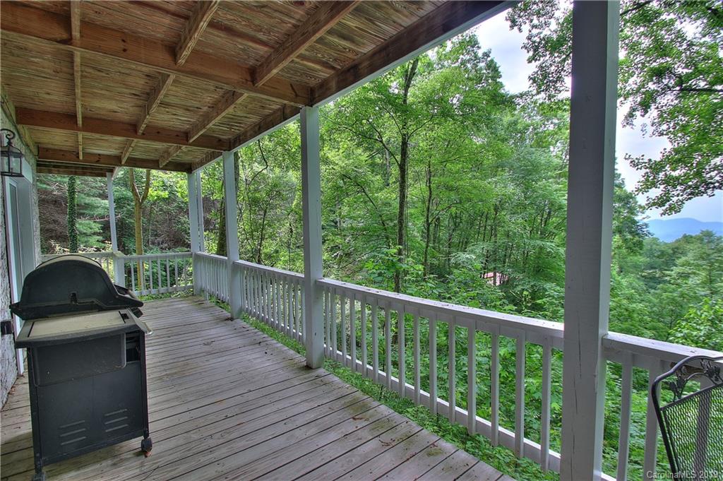 149 Irwin Way Clyde, NC 28721 - Photo 23 of 29 a view of a balcony with wooden floor
