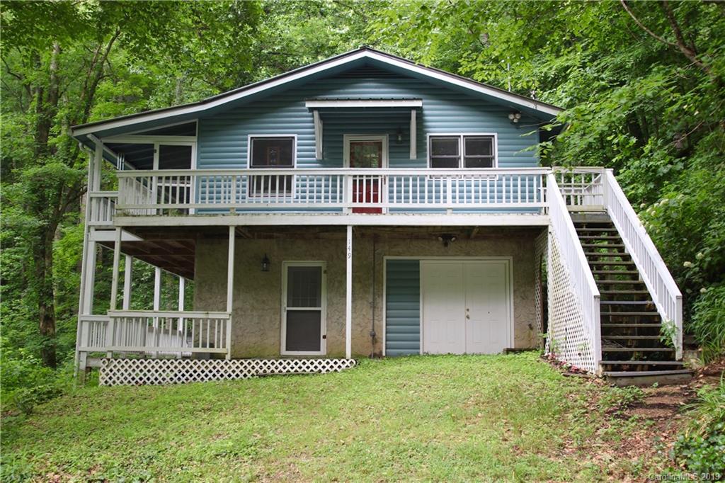 149 Irwin Way Clyde, NC 28721 - Photo 29 of 29 a front view of a house with a garden