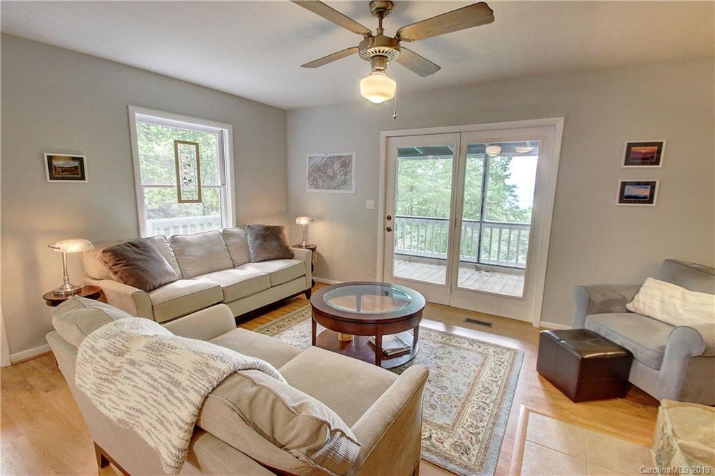 149 Irwin Way Clyde, NC 28721 - Photo 5 of 29 a living room with furniture and a large window