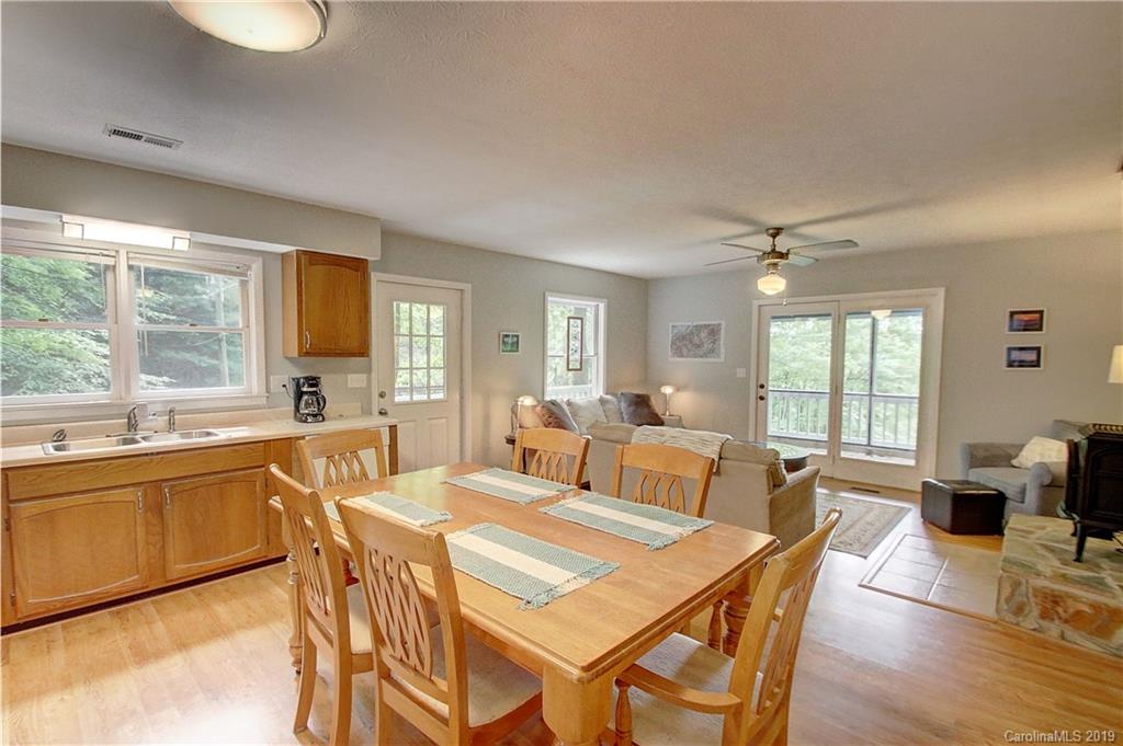 149 Irwin Way Clyde, NC 28721 - Photo 8 of 29 a large kitchen with a table and chairs