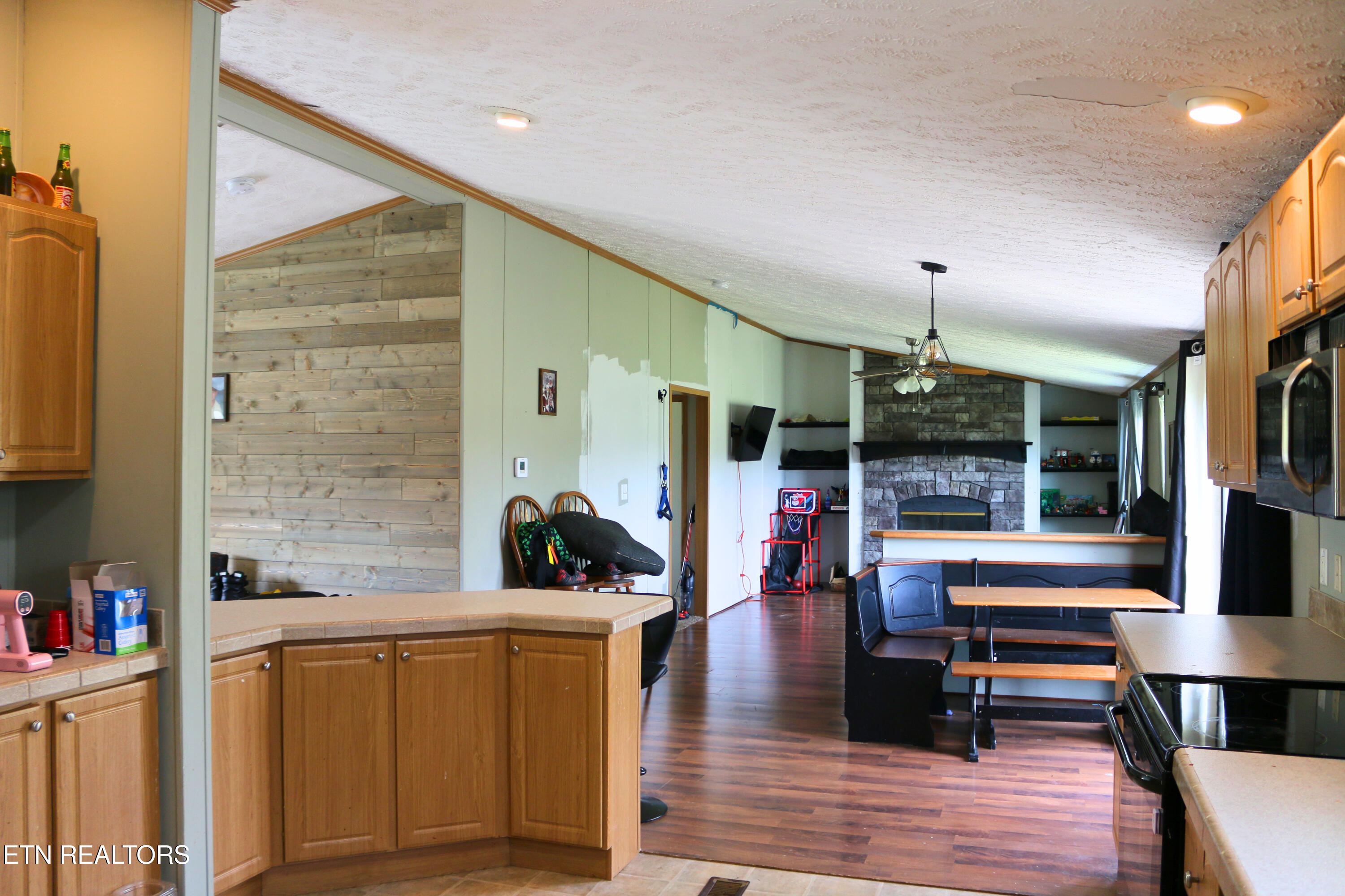 680 Forkner Chapel Road Sweetwater, TN 37874 - Photo 11 of 22 kitchen and den with fireplace