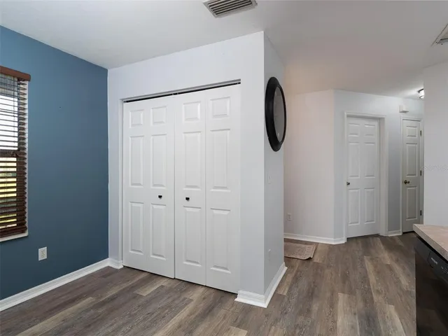 a view of an entryway with wooden floor