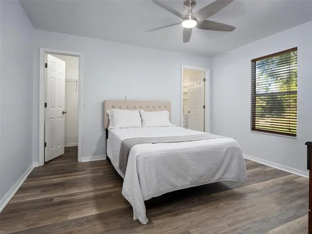 a bedroom with a bed and window