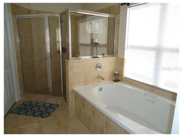 a bathroom with a bathtub and a sink