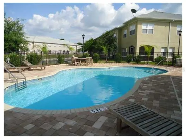 a view of a swimming pool with a patio