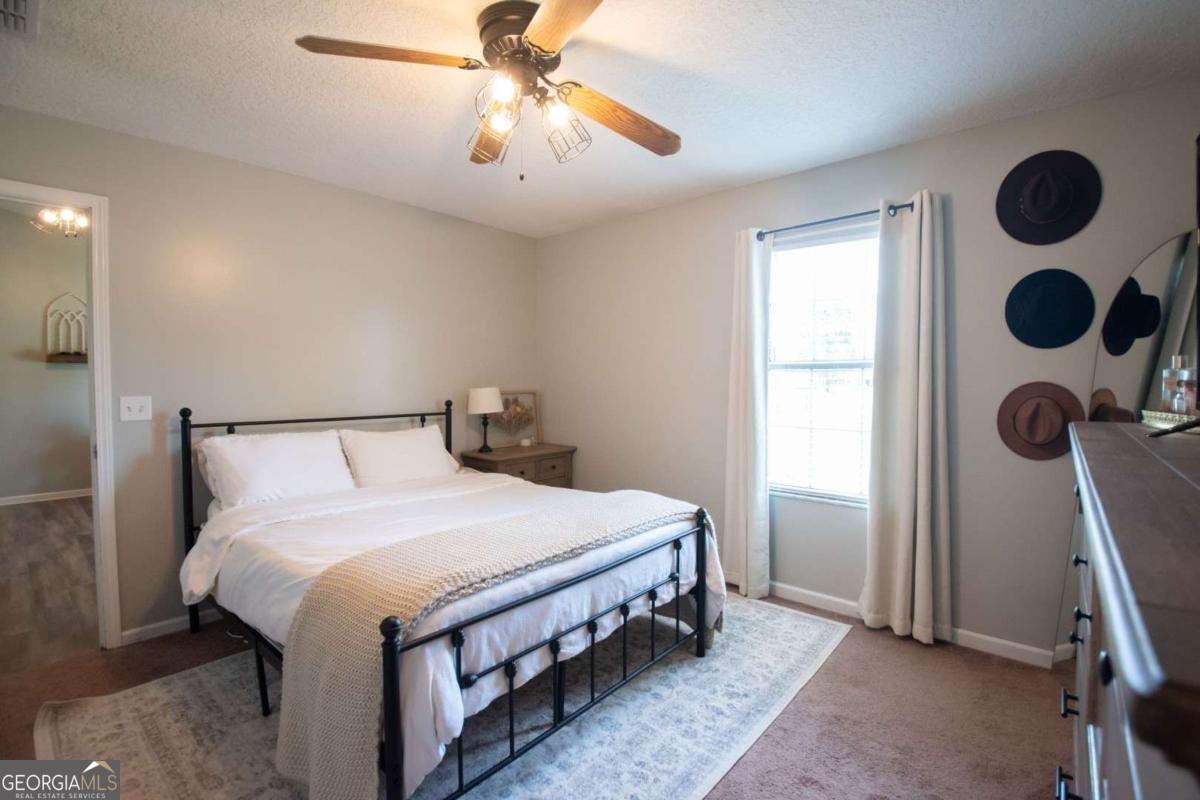 564 Dallas Circle Folkston, GA 31537 - Photo 14 of 21 a bedroom with a bed and a window