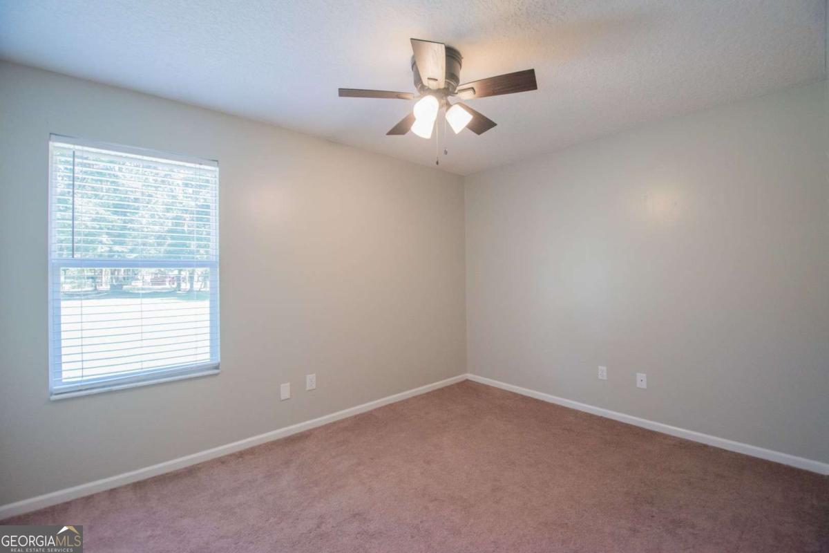 564 Dallas Circle Folkston, GA 31537 - Photo 17 of 21 an empty room with a window