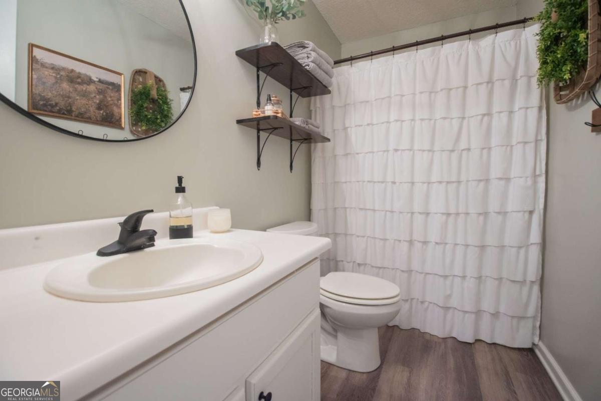 564 Dallas Circle Folkston, GA 31537 - Photo 18 of 21 a bathroom with a toilet and a sink