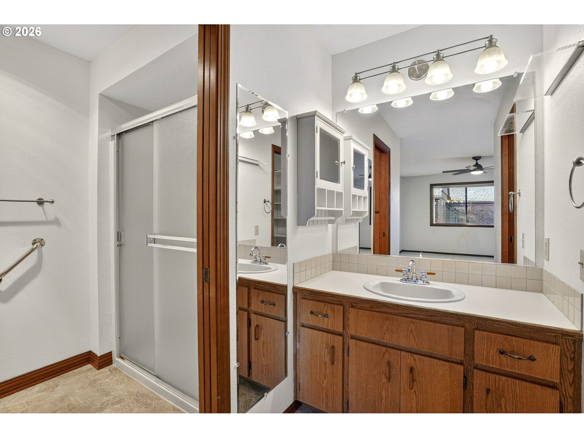 15485 Southwest 114th Court, Unit 39 Portland, OR 97224 - Photo 15 of 32 a bathroom with a sink double vanity and a mirror