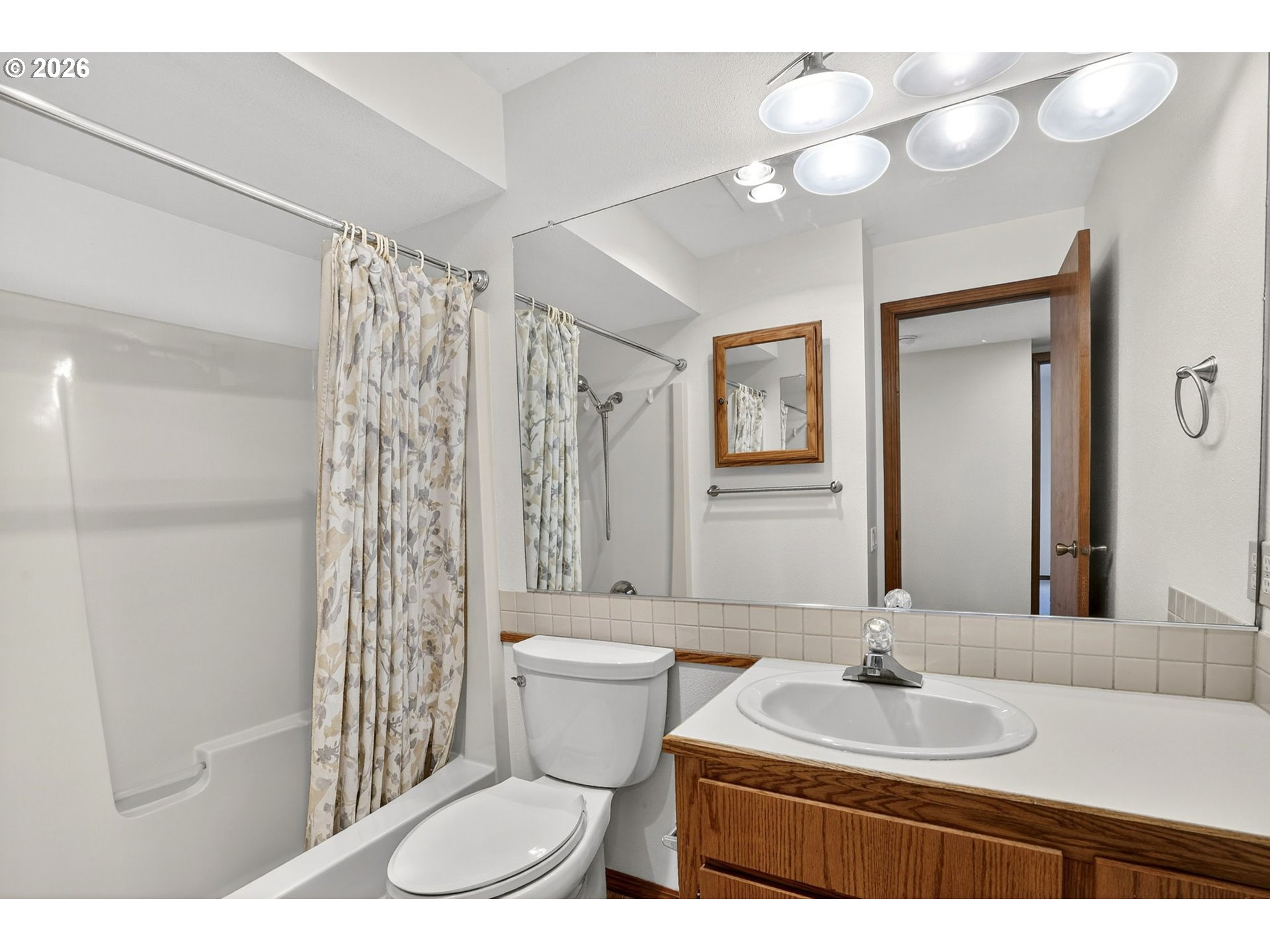 15485 Southwest 114th Court, Unit 39 Portland, OR 97224 - Photo 20 of 32 a bathroom with a sink toilet vanity and shower
