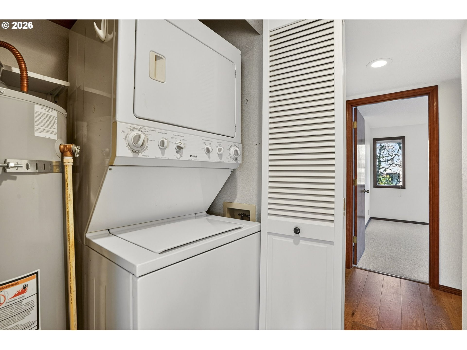 15485 Southwest 114th Court, Unit 39 Portland, OR 97224 - Photo 21 of 32 a view of washer and dryer with bathroom