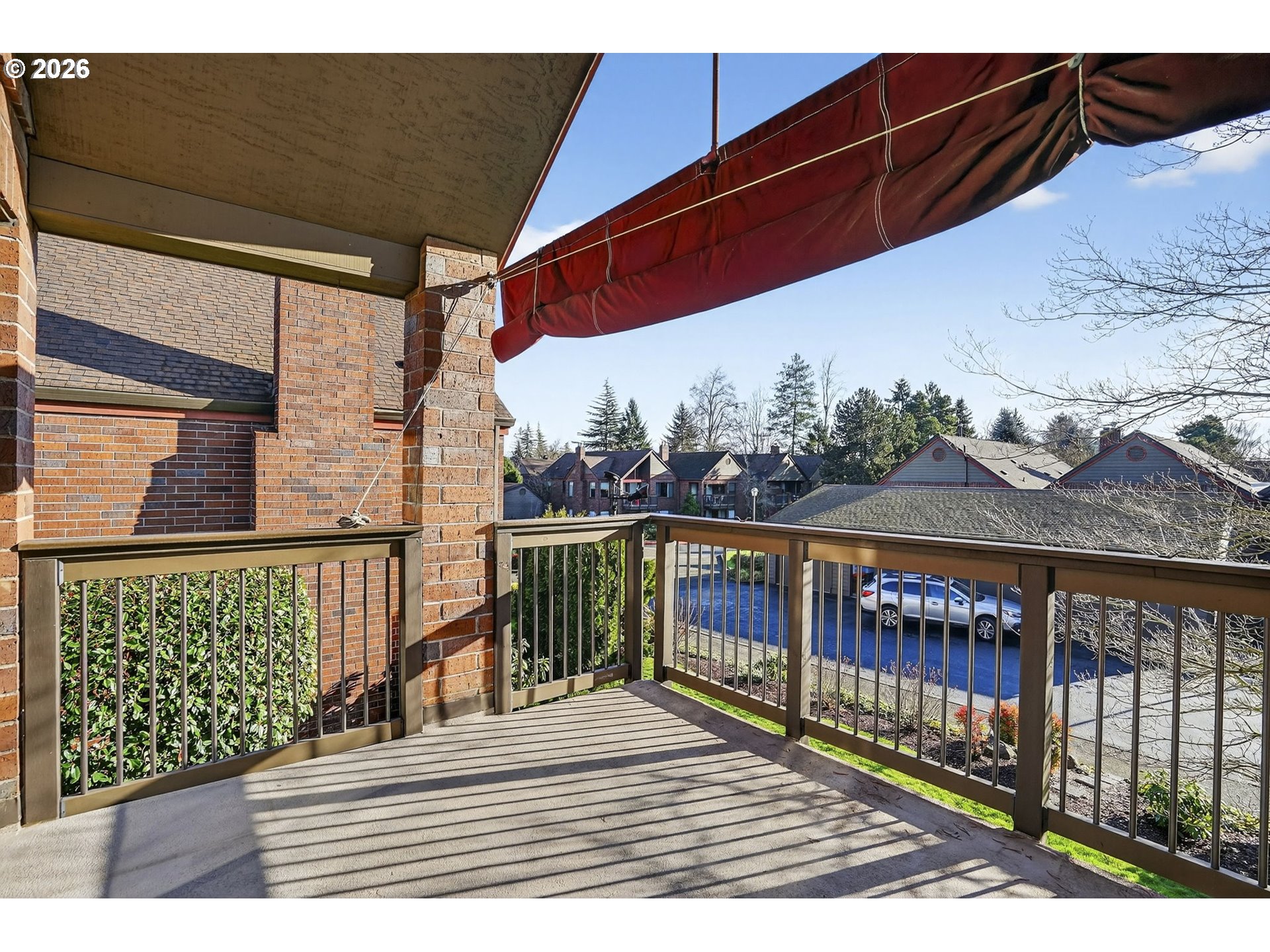 15485 Southwest 114th Court, Unit 39 Portland, OR 97224 - Photo 22 of 32 a view of a balcony with wooden floor