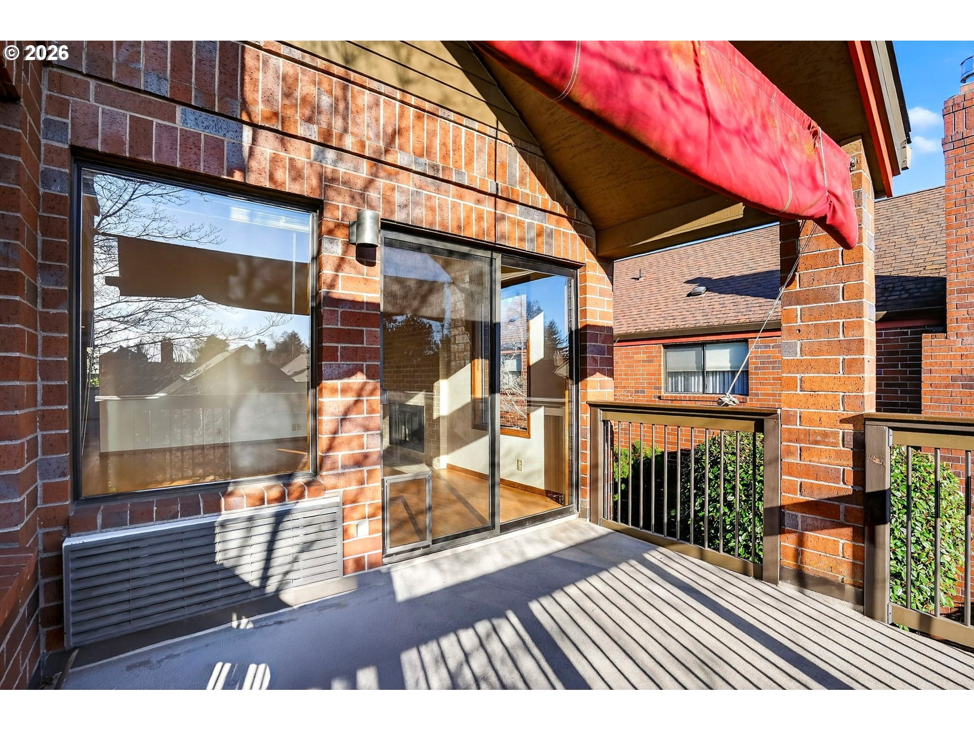 15485 Southwest 114th Court, Unit 39 Portland, OR 97224 - Photo 23 of 32 a view of a brick building with a door and wooden floor