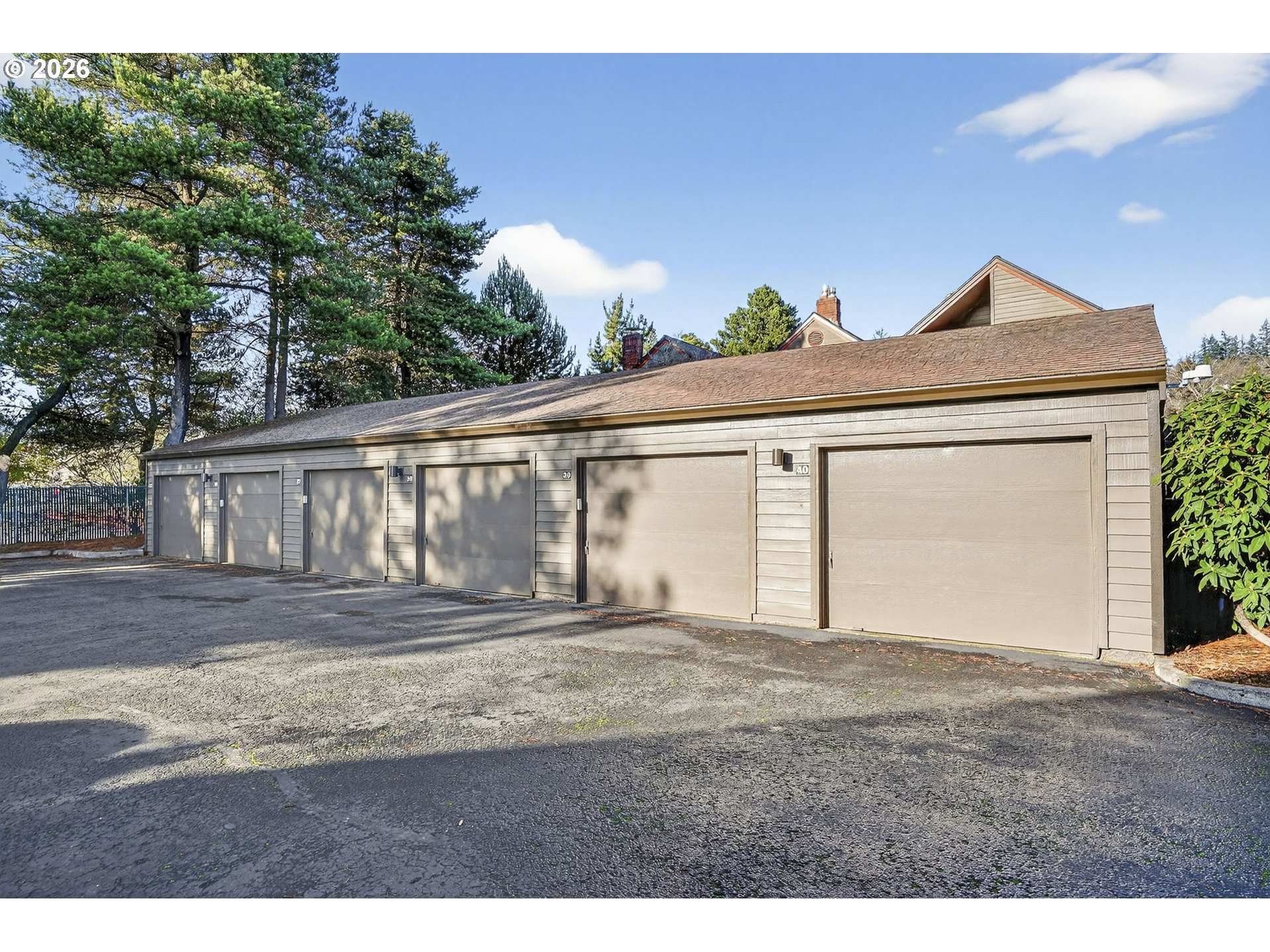 15485 Southwest 114th Court, Unit 39 Portland, OR 97224 - Photo 26 of 32 a front view of a house with a yard