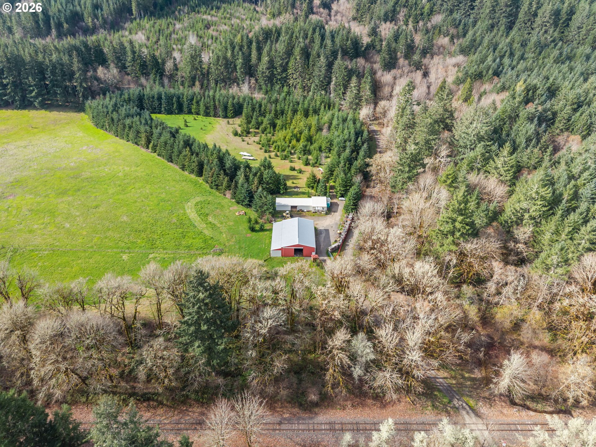 22994 Red Oak Lane Veneta, OR 97487 - Photo 15 of 28 a aerial view of a house with a yard and lake view
