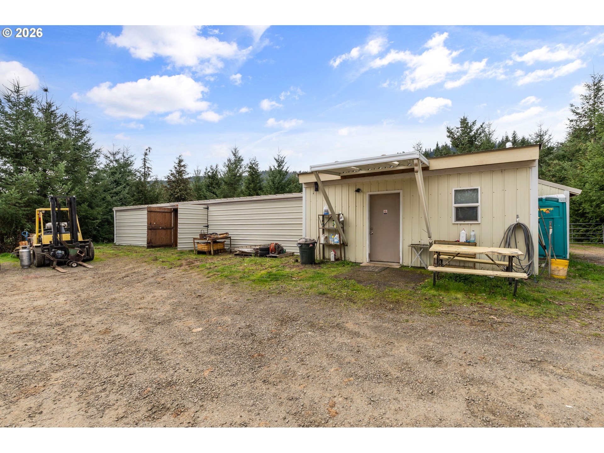 22994 Red Oak Lane Veneta, OR 97487 - Photo 21 of 28 a view of a backyard with a garden and entertaining space