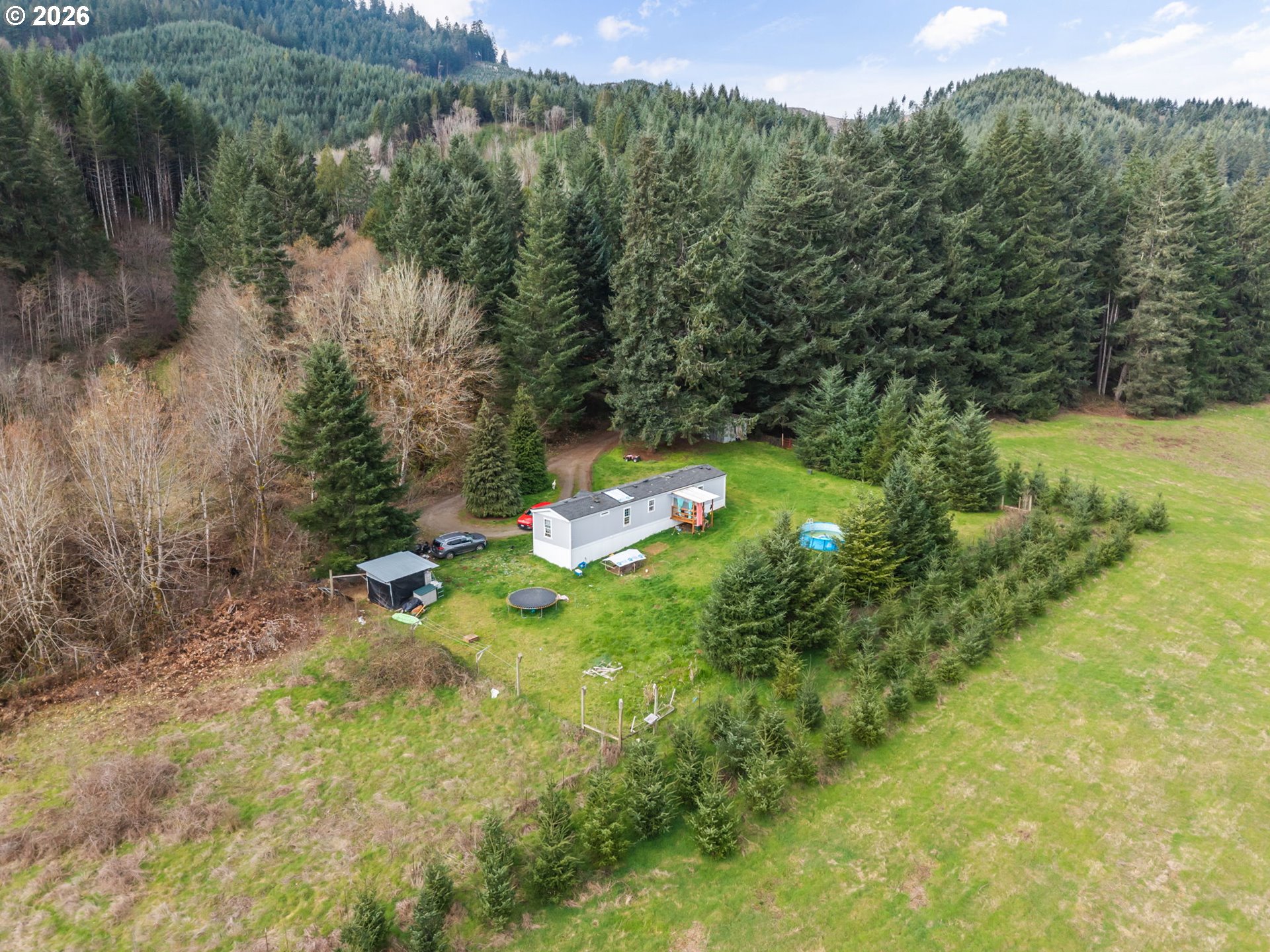 22994 Red Oak Lane Veneta, OR 97487 - Photo 25 of 28 a backyard of a house with a yard and lake view