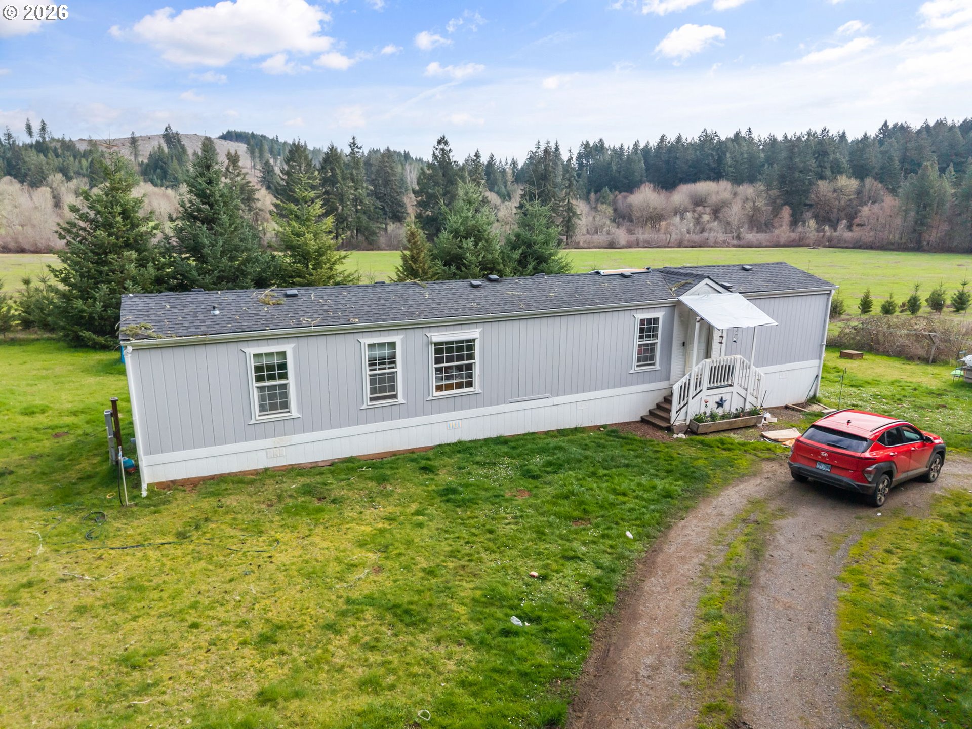 22994 Red Oak Lane Veneta, OR 97487 - Photo 27 of 28 a view of a house with a yard