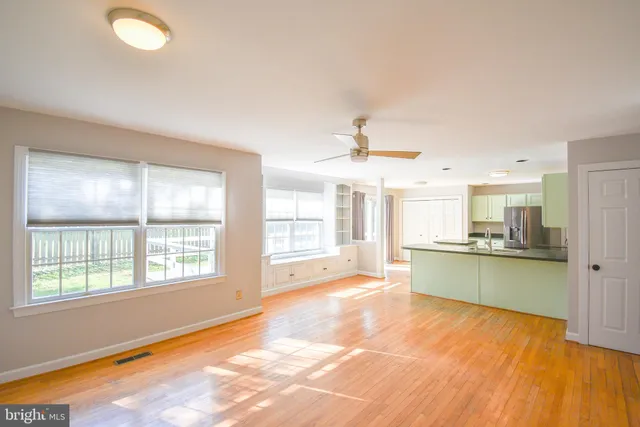 a bathroom with a large window sink and a bathtub