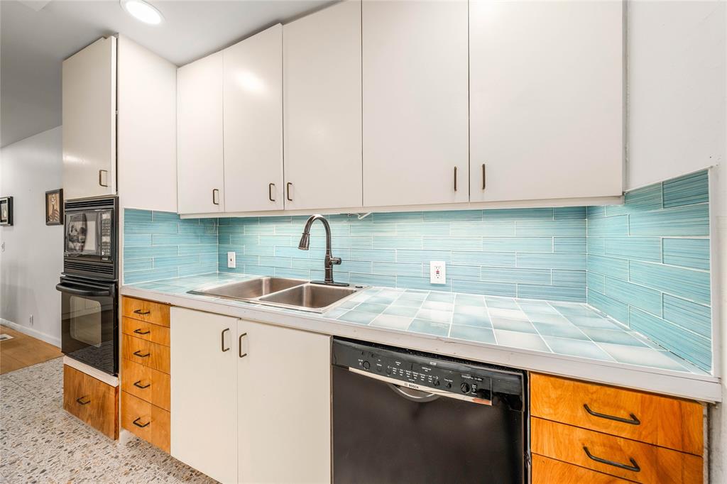 3020 North 43rd Street Waco, TX 76708 - Photo 13 of 40 a kitchen with granite countertop a sink and cabinets