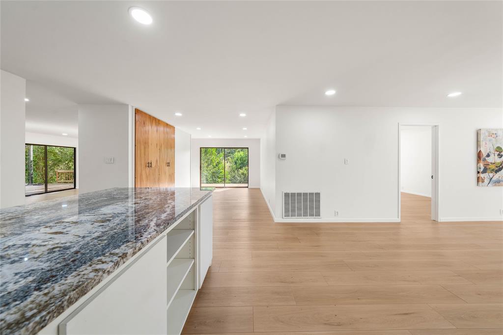 3020 North 43rd Street Waco, TX 76708 - Photo 15 of 40 a view of kitchen and kitchen with granite countertop a sink